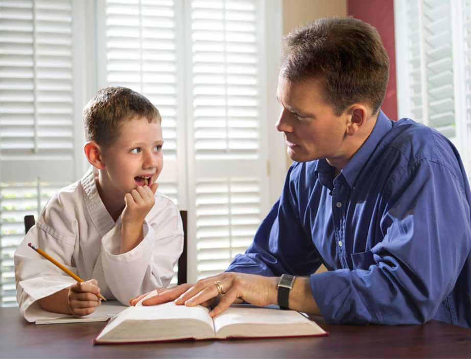 parent helping a child with schoolwork