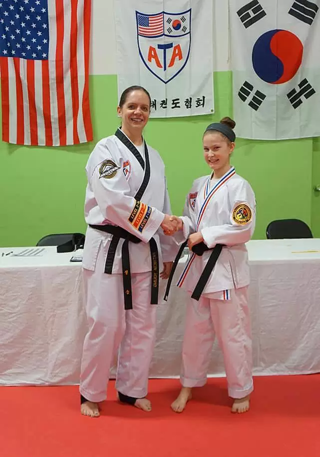 4Kicks Family Taekwondo student getting an award
